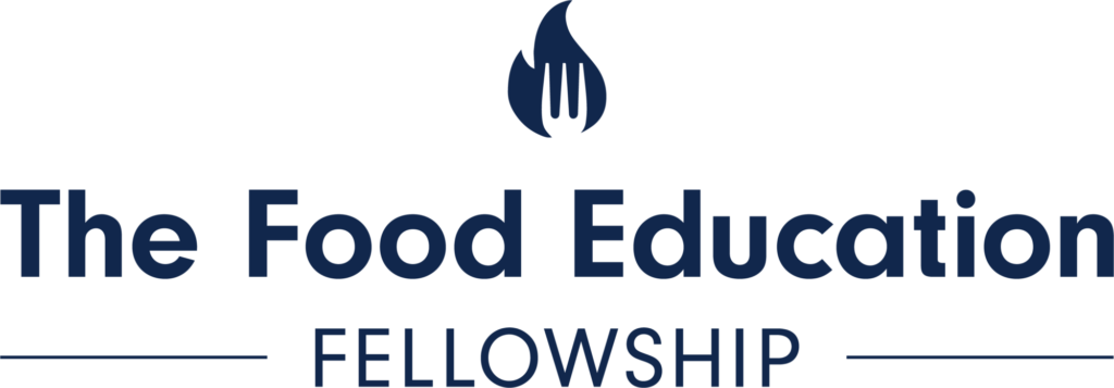 The Food Education Fellowship logo - Pilot Light's flame and fork logo in navy blue. Communicates connection to the Food Education Fellowship program. 