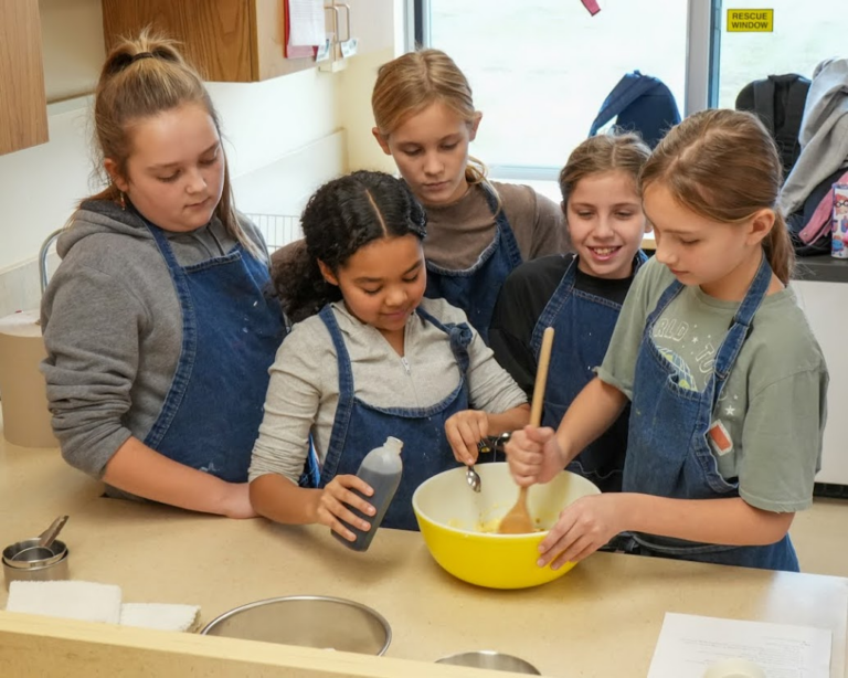 Middle school students practice cooking together in central New York.